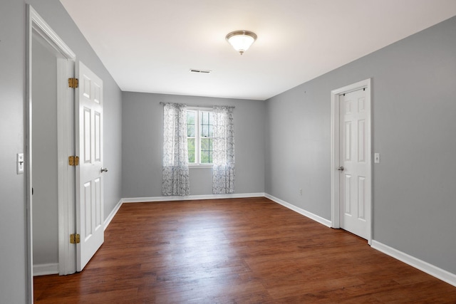 1719 Wynnewood Dr, Chapmansboro, TN 37035 - spare room featuring wood finished floors, visible vents, and baseboards