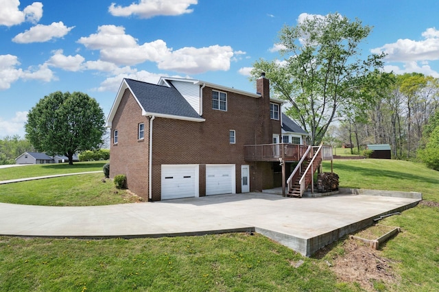 1719 Wynnewood Dr, Chapmansboro, TN 37035 - back of house featuring a chimney, a lawn, a deck, brick siding, and stairs