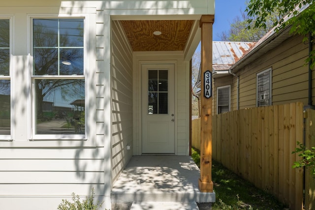 doorway to property with fence