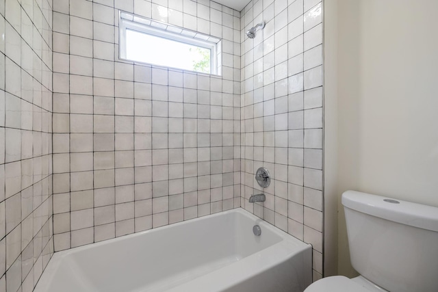 bathroom with toilet and shower / washtub combination