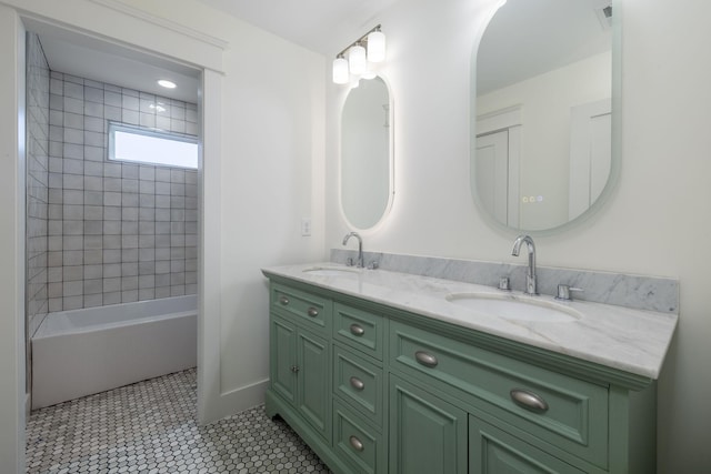bathroom with shower / bath combination, double vanity, a sink, and visible vents