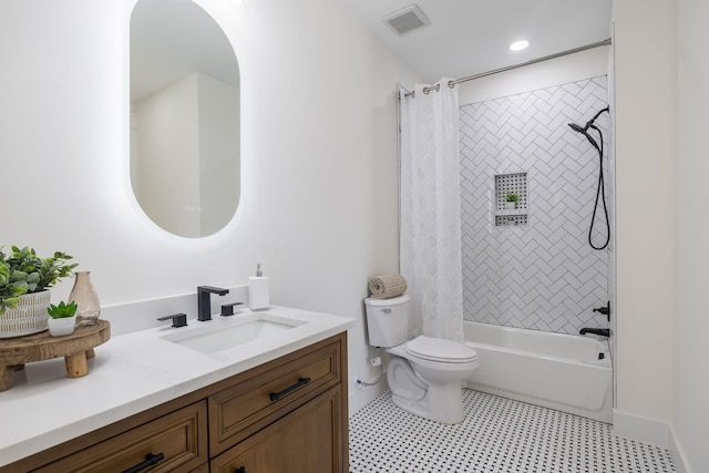 bathroom featuring shower / bath combo, vanity, visible vents, and toilet