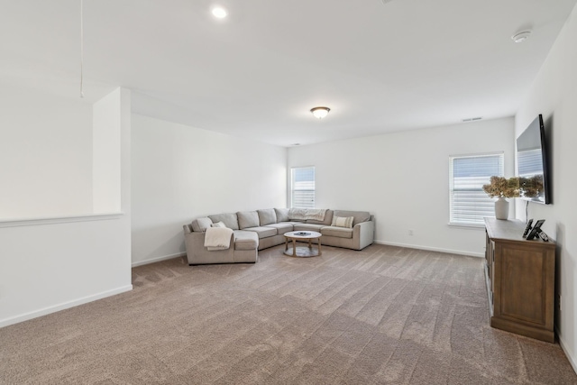 living room with carpet floors and baseboards