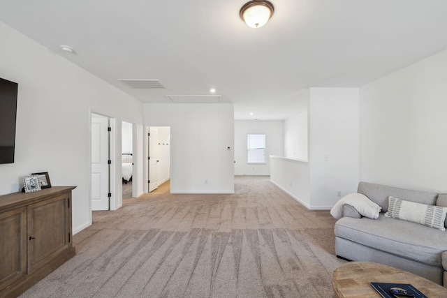 carpeted living room with attic access, baseboards, visible vents, and recessed lighting