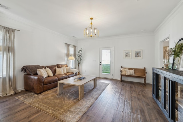 living room featuring a chandelier, visible vents, crown molding, and dark wood finished floors