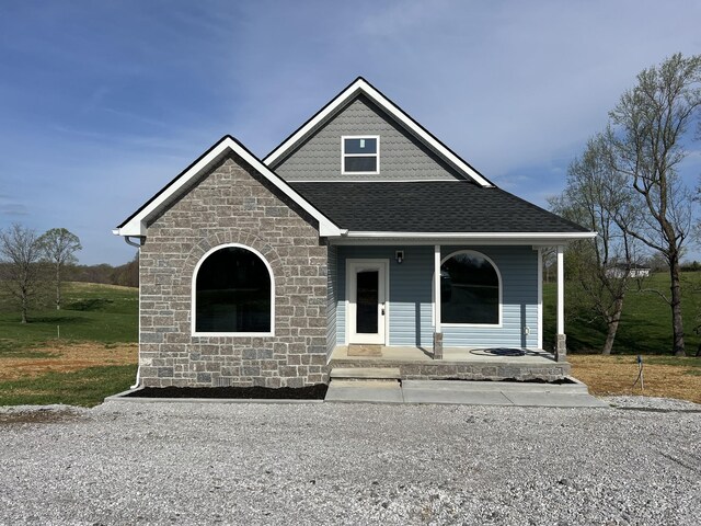5291 Galen Rd, Lafayette, TN 37083 - craftsman house featuring a shingled roof, covered porch, and stone siding