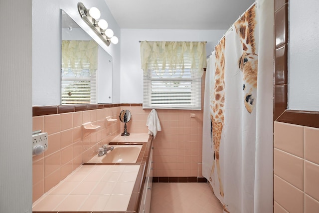 5007 Bonnalynn Dr, Hermitage, TN 37076 - bathroom with tile walls, plenty of natural light, vanity, and wainscoting