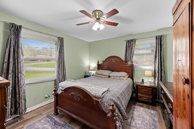 5007 Bonnalynn Dr, Hermitage, TN 37076 - bedroom featuring ceiling fan, multiple windows, baseboards, and wood finished floors