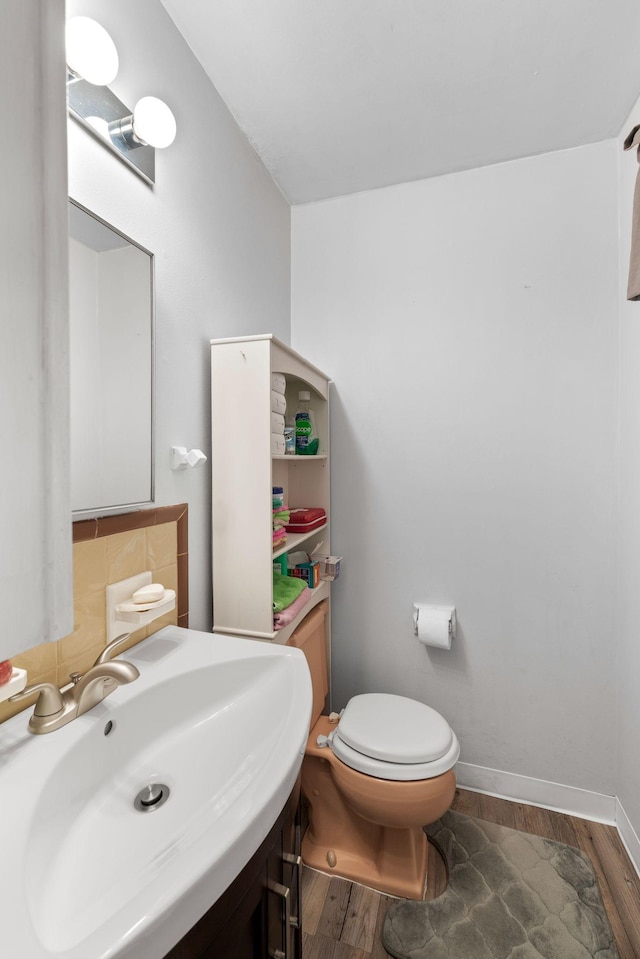 5007 Bonnalynn Dr, Hermitage, TN 37076 - half bathroom with a sink, toilet, and wood finished floors