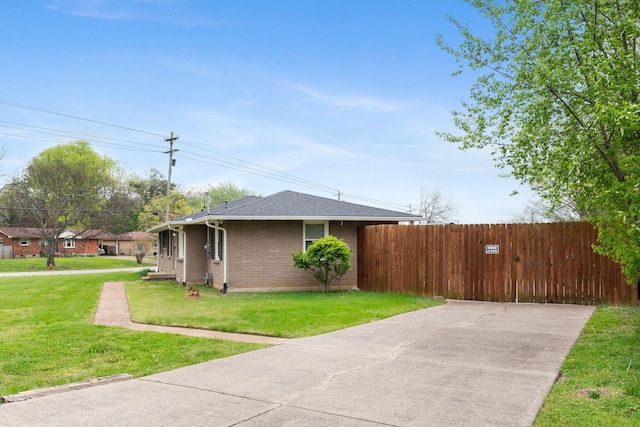 5007 Bonnalynn Dr, Hermitage, TN 37076 - view of property exterior featuring a yard, fence, and brick siding