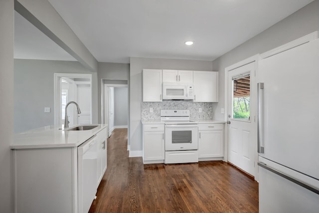 701 Santa Fe Pike, Columbia, TN 38401 - kitchen with a sink, dark wood-style flooring, light countertops, white appliances, and white cabinetry