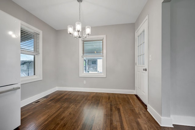 701 Santa Fe Pike, Columbia, TN 38401 - unfurnished dining area featuring visible vents, plenty of natural light, a chandelier, and hardwood / wood-style flooring