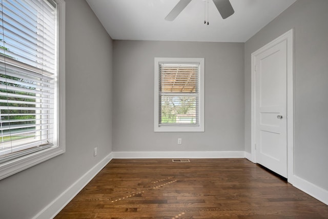 701 Santa Fe Pike, Columbia, TN 38401 - spare room featuring dark wood-style floors, baseboards, a ceiling fan, and a healthy amount of sunlight