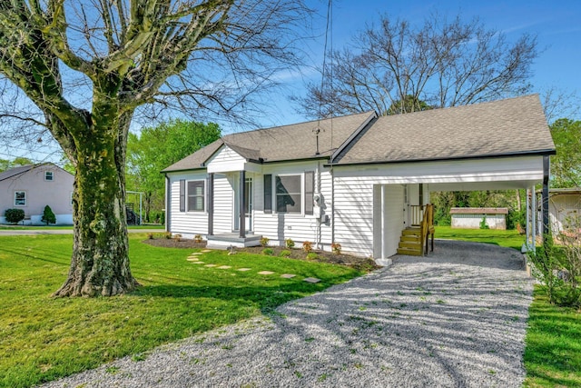 701 Santa Fe Pike, Columbia, TN 38401 - single story home with a carport, a front lawn, a shingled roof, and gravel driveway