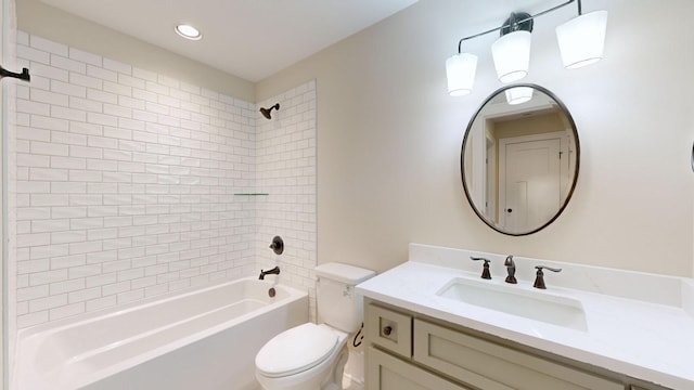 bathroom featuring toilet, recessed lighting, vanity, and bathing tub / shower combination