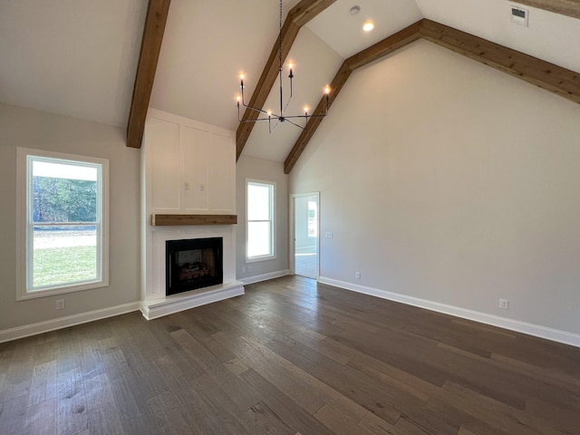 unfurnished living room featuring baseboards, high vaulted ceiling, a notable chandelier, and a fireplace