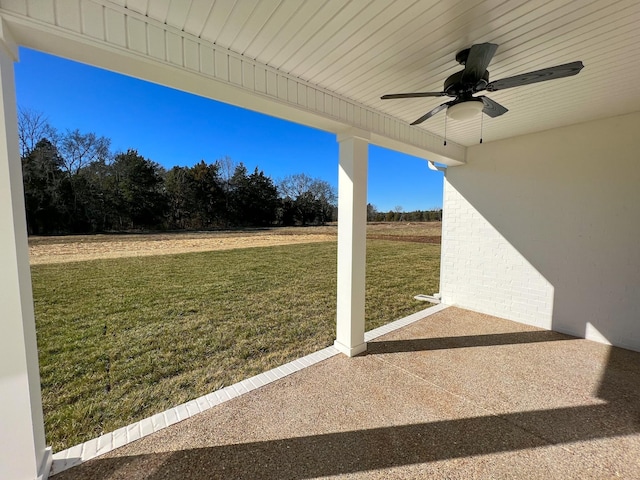 view of yard with a patio and a ceiling fan