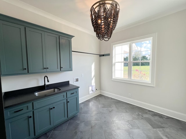 kitchen with baseboards, an inviting chandelier, crown molding, dark countertops, and a sink