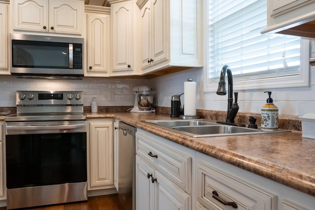 4769 Ellen Cir, Cookeville, TN 38501 - kitchen featuring decorative backsplash, a sink, and stainless steel appliances
