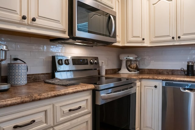 4769 Ellen Cir, Cookeville, TN 38501 - kitchen with dark countertops, backsplash, and stainless steel appliances