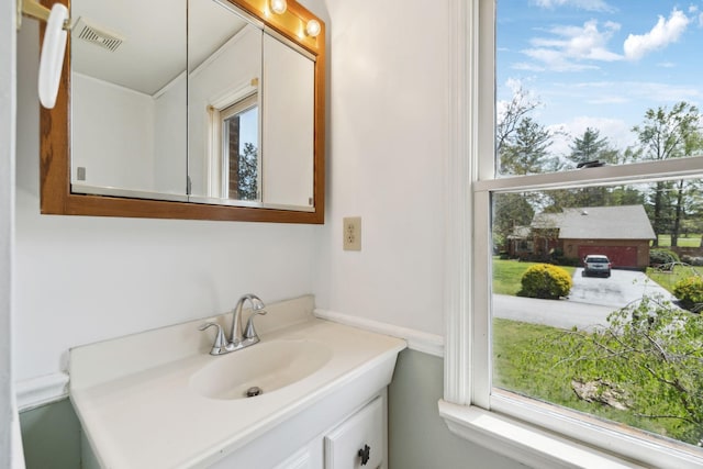 bathroom featuring vanity and visible vents