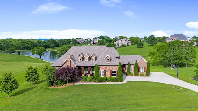 6516 Brandon Park Way, Franklin, TN 37064 - new england style home featuring a front lawn and a water view