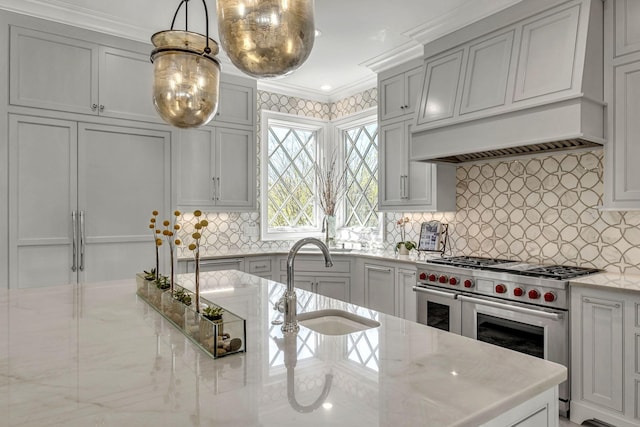 328 White Swans Xing, Brentwood, TN 37027 - kitchen with a sink, crown molding, double oven range, backsplash, and pendant lighting