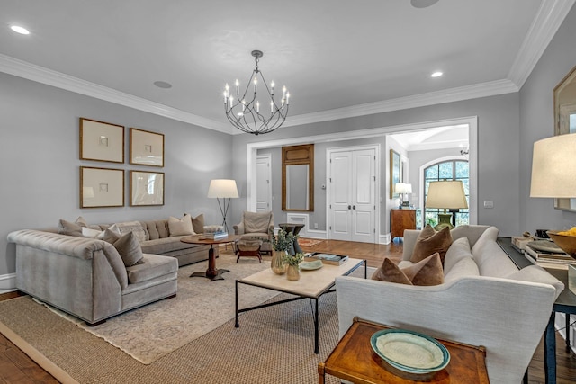 328 White Swans Xing, Brentwood, TN 37027 - living room with a notable chandelier, ornamental molding, and wood finished floors