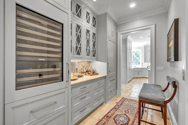 328 White Swans Xing, Brentwood, TN 37027 - bar with tasteful backsplash, recessed lighting, a bar, crown molding, and beverage cooler