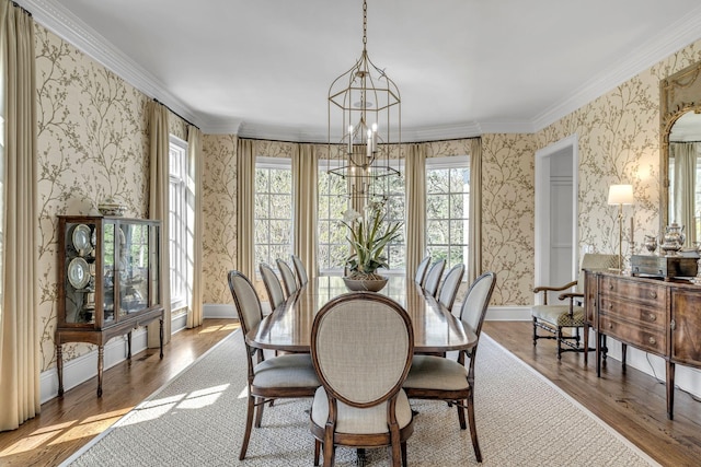 328 White Swans Xing, Brentwood, TN 37027 - dining space with ornamental molding, a chandelier, wood finished floors, and wallpapered walls