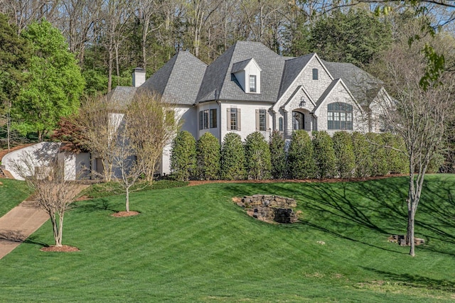 328 White Swans Xing, Brentwood, TN 37027 - view of front facade with a shingled roof, a front yard, and a chimney