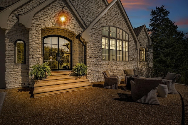 328 White Swans Xing, Brentwood, TN 37027 - exterior entry at dusk with stone siding