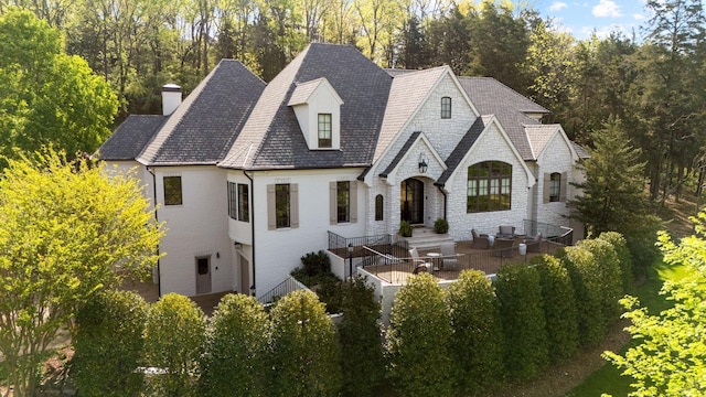 328 White Swans Xing, Brentwood, TN 37027 - rear view of property with stone siding and a chimney