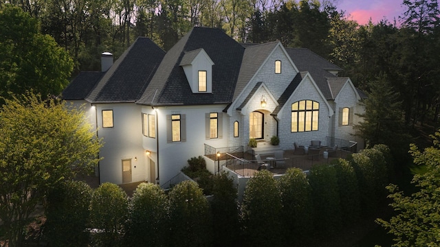 328 White Swans Xing, Brentwood, TN 37027 - back of house featuring stone siding and a chimney