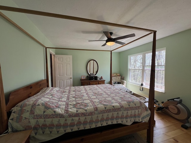 bedroom with ceiling fan and wood finished floors