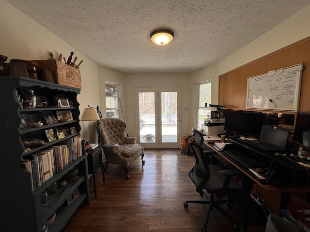 office area featuring dark wood-style flooring and a textured ceiling