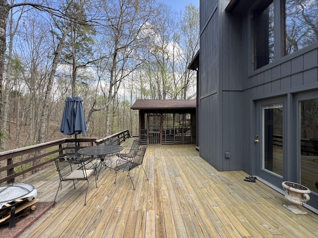 deck with outdoor dining area