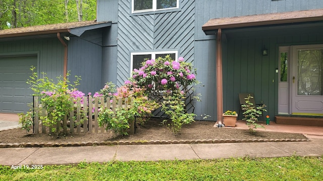 view of exterior entry featuring a garage