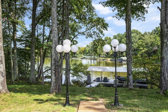 exterior space featuring a water view and a lawn