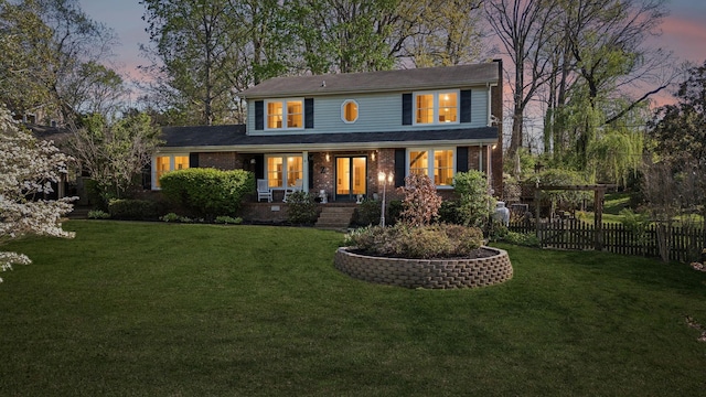 124 Timber Trail Dr, Lebanon, TN 37090 - view of front of house with brick siding, fence, and a lawn