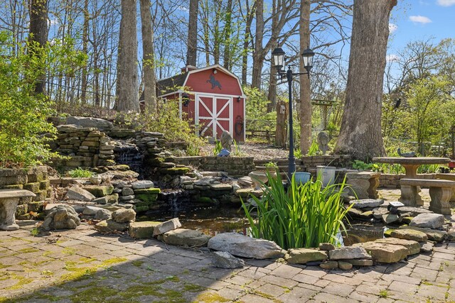 124 Timber Trail Dr, Lebanon, TN 37090 - view of yard featuring a barn, a garden pond, and an outdoor structure