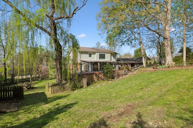 124 Timber Trail Dr, Lebanon, TN 37090 - rear view of property featuring a yard, fence, a deck, and a hot tub