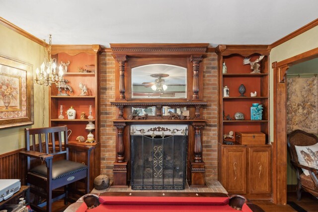 124 Timber Trail Dr, Lebanon, TN 37090 - living room featuring built in shelves, a ceiling fan, crown molding, and a brick fireplace