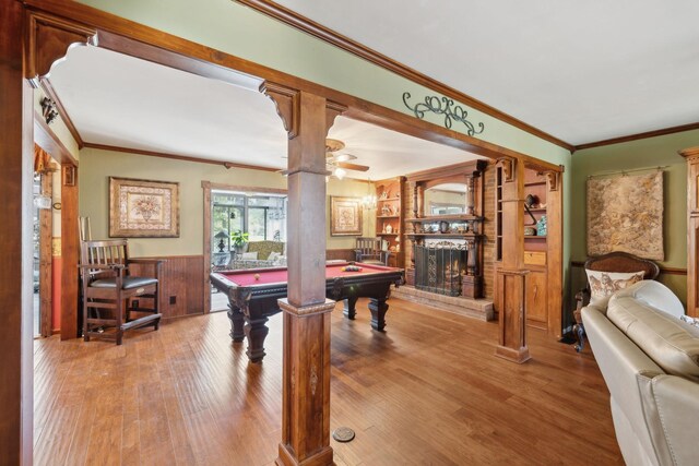 124 Timber Trail Dr, Lebanon, TN 37090 - recreation room with wood finished floors, a fireplace, billiards, and crown molding