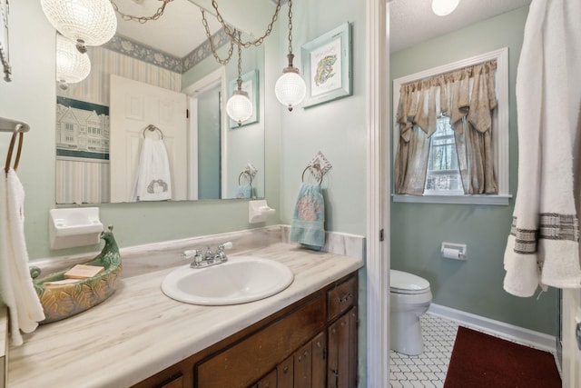 124 Timber Trail Dr, Lebanon, TN 37090 - bathroom with baseboards, vanity, and toilet