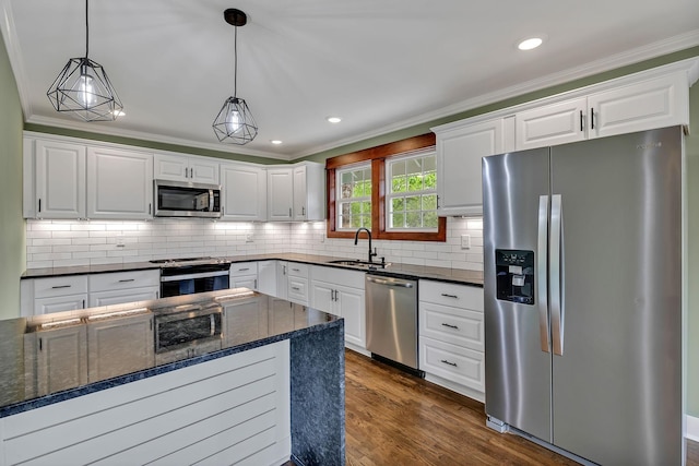 kitchen featuring stainless steel appliances, white cabinetry, and a sink