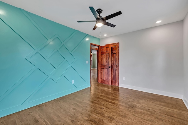 empty room with recessed lighting, baseboards, a ceiling fan, and wood finished floors