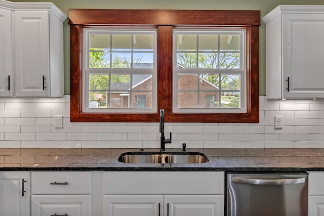 kitchen featuring a sink, white cabinets, tasteful backsplash, and dishwasher
