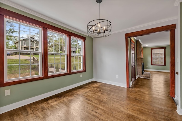 unfurnished dining area with a chandelier, baseboards, and plenty of natural light