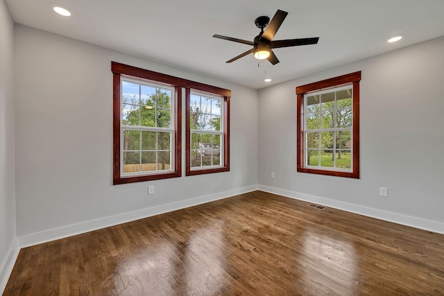 unfurnished room featuring baseboards, recessed lighting, a ceiling fan, visible vents, and wood finished floors